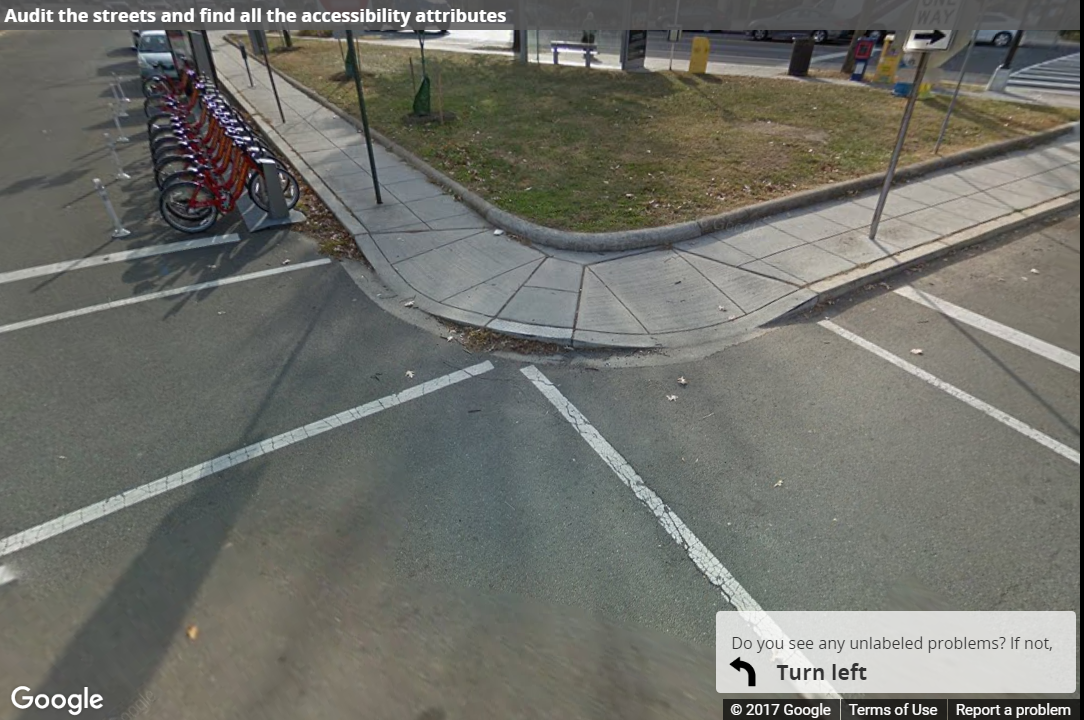 A Street View image of a curb ramp with poor landing space