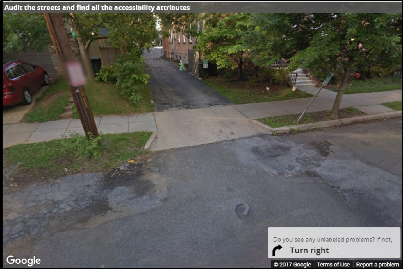 A Street View image of a driveway level with the sidewalk