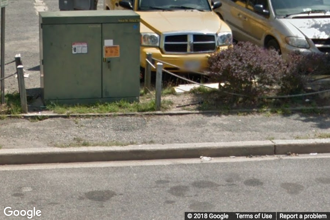 A Street View image of a gravel sidewalk